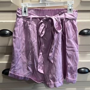 Purple paper bag shorts with a tie wrap waistband